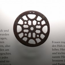 Fertility Amulets, two pierced decorative discs, cross, sun